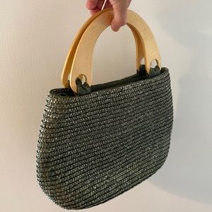 Woven green purse with wooden handles